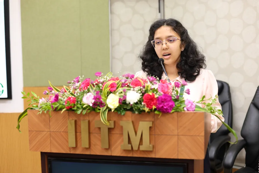 A student presenter at the podium