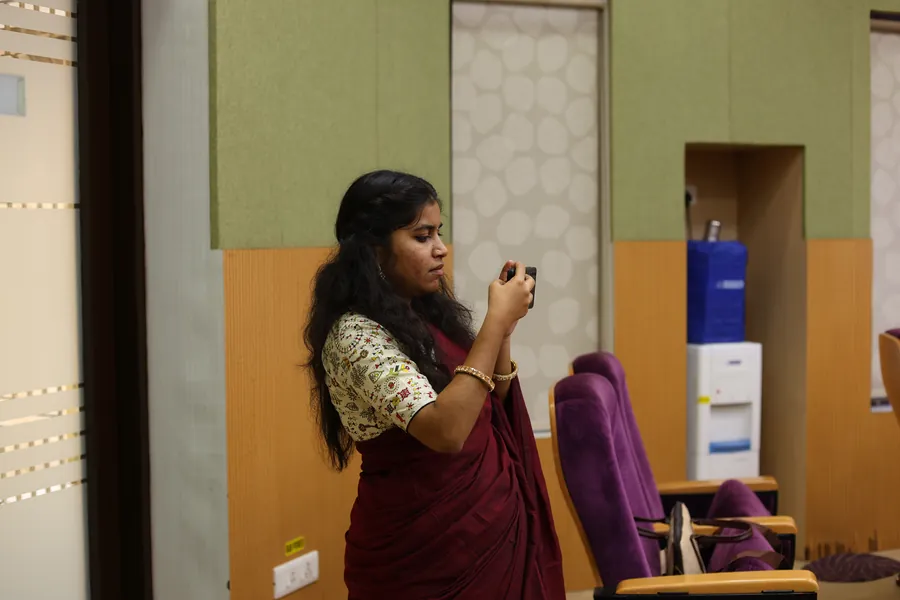 A presenter walking the audience through her slides