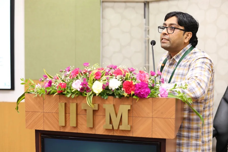 A speaker addressing a technical session at IC&SR
