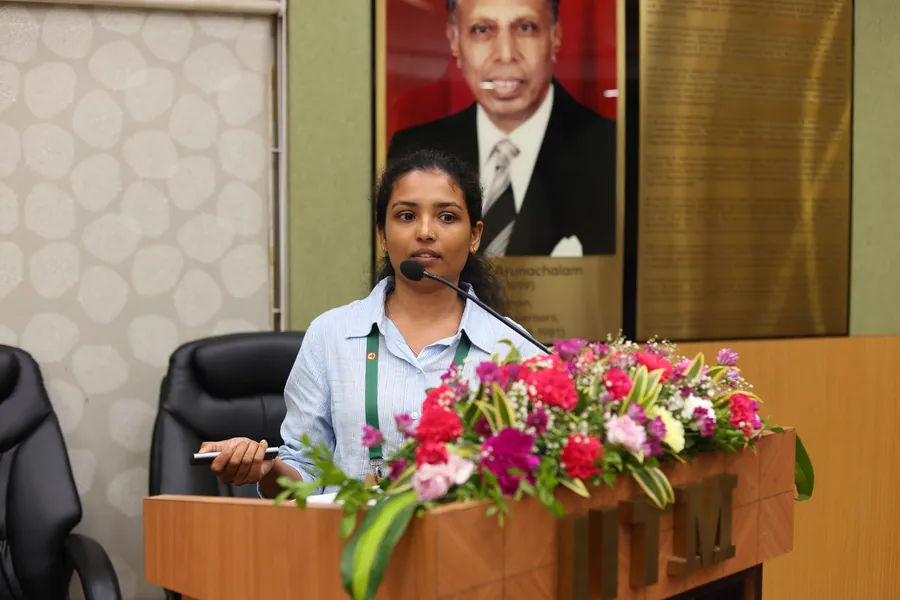 A research scholar presenting her work